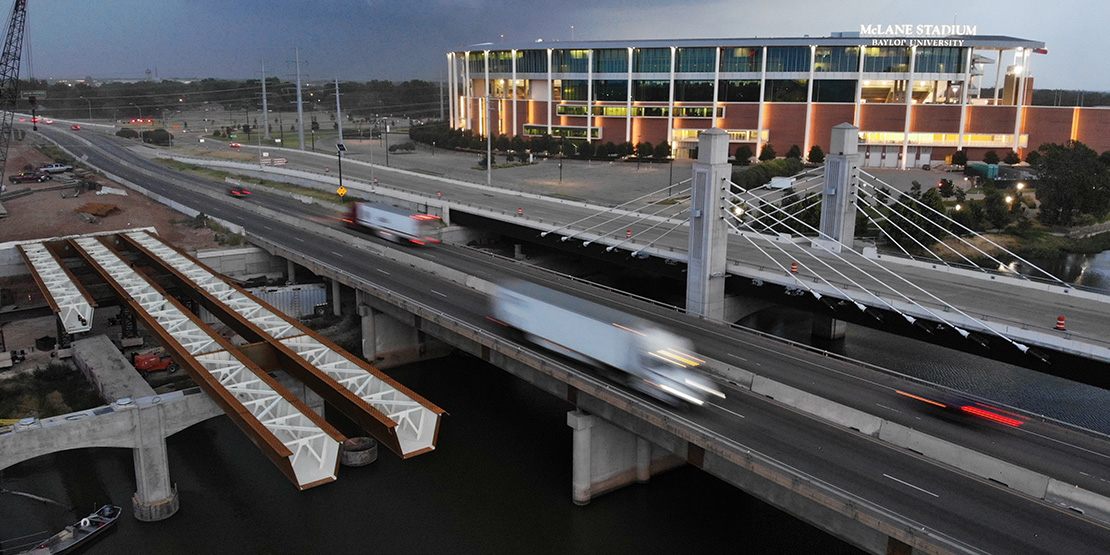 Fast moving cars zooming by on the IH 35 Waco 4B reconstruction designed by BGE, Inc.
