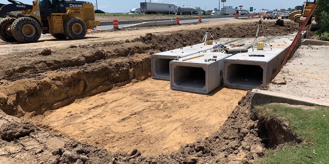 Concrete supports being laid into the ground for the new IH 35 Waco 4B freeway  