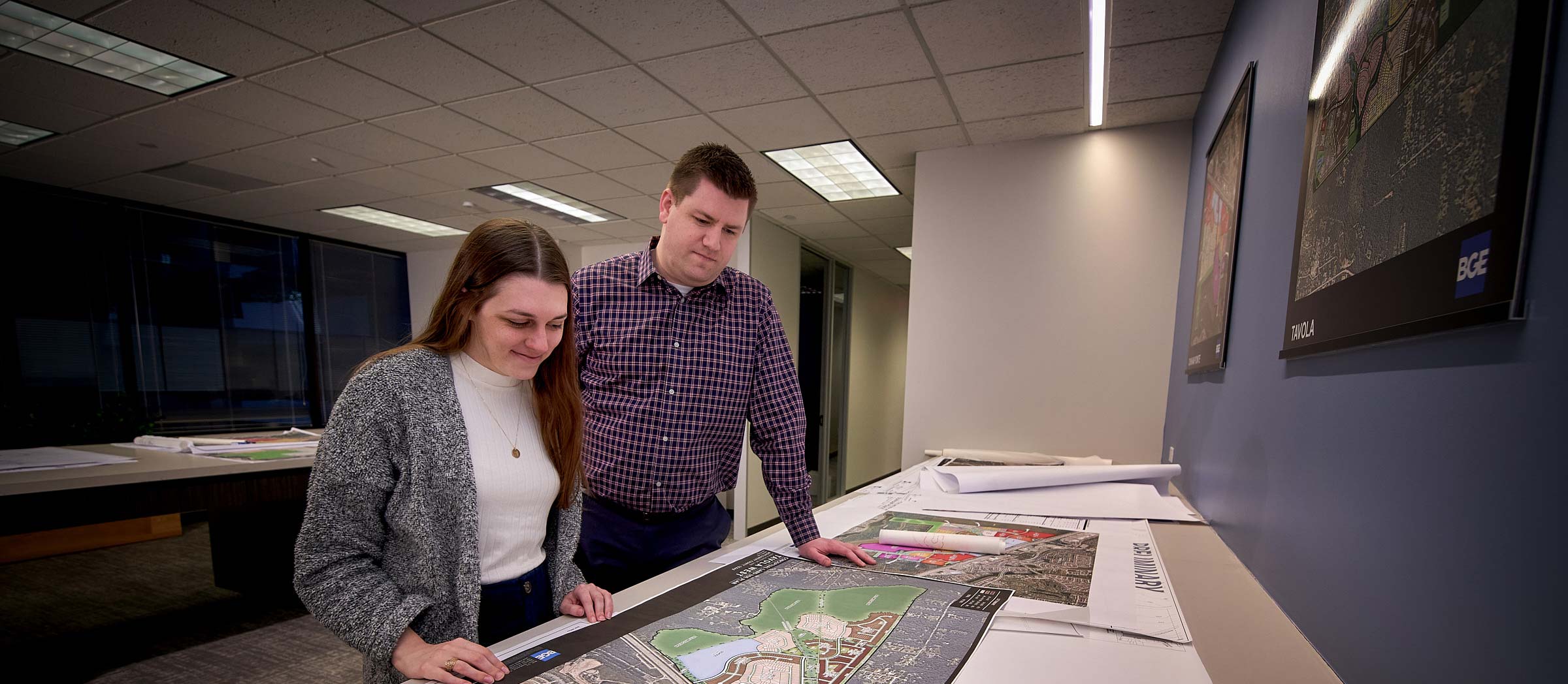 Two BGE team members going over plans