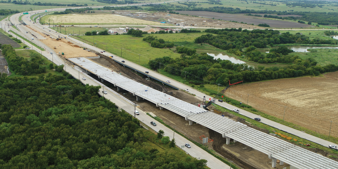 Aerial view of construction leading away from the construction of the bridge over US 380 for the Dallas North Tollway Phase 4A project.